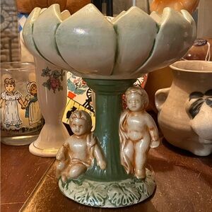 Vintage cherub and pond Lilly pedestal dish with green accents.